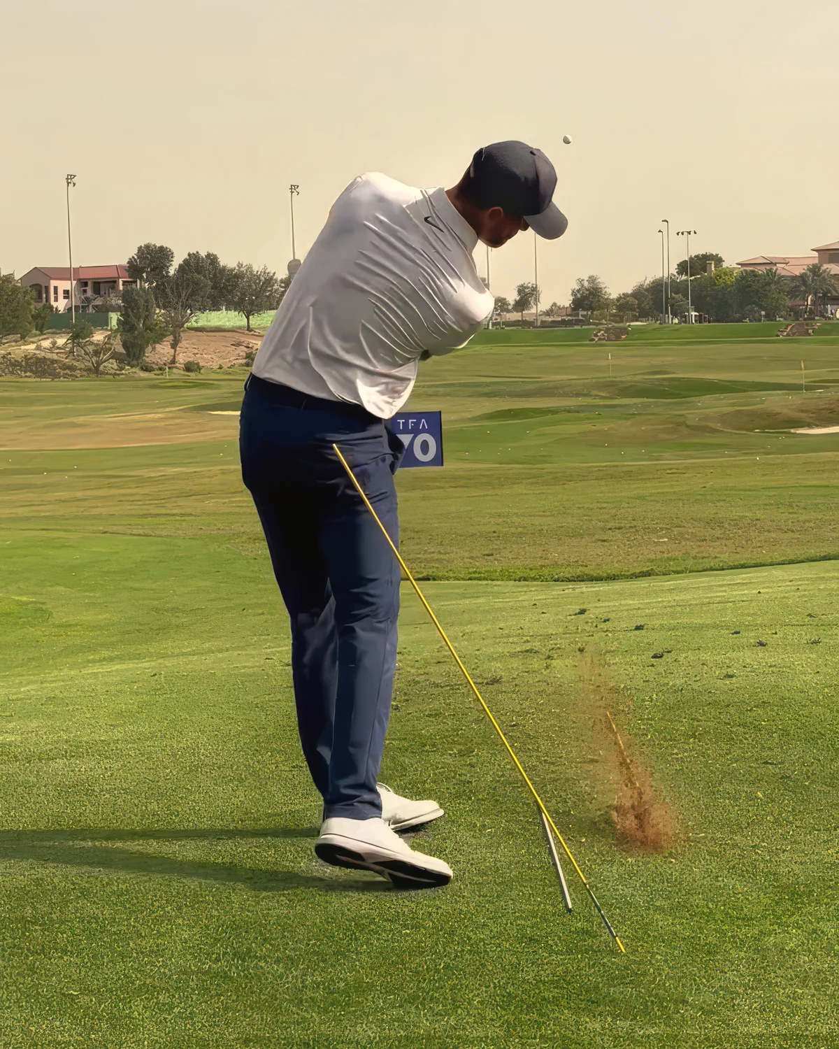 Euan through impact at the Tommy Fleetwood Academy, the divot flying